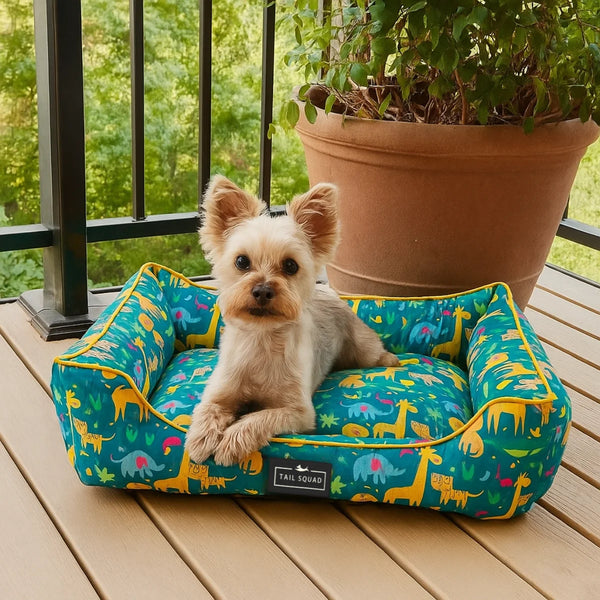 Dog sitting on Tail Squad Washable Printed Lounger Bed Forest Kin close front view with cozy cushioned sleeping surface