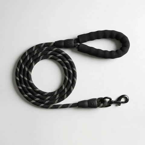 Black reflective rope dog leash with durable handle and secure metal clasp for daily walks.