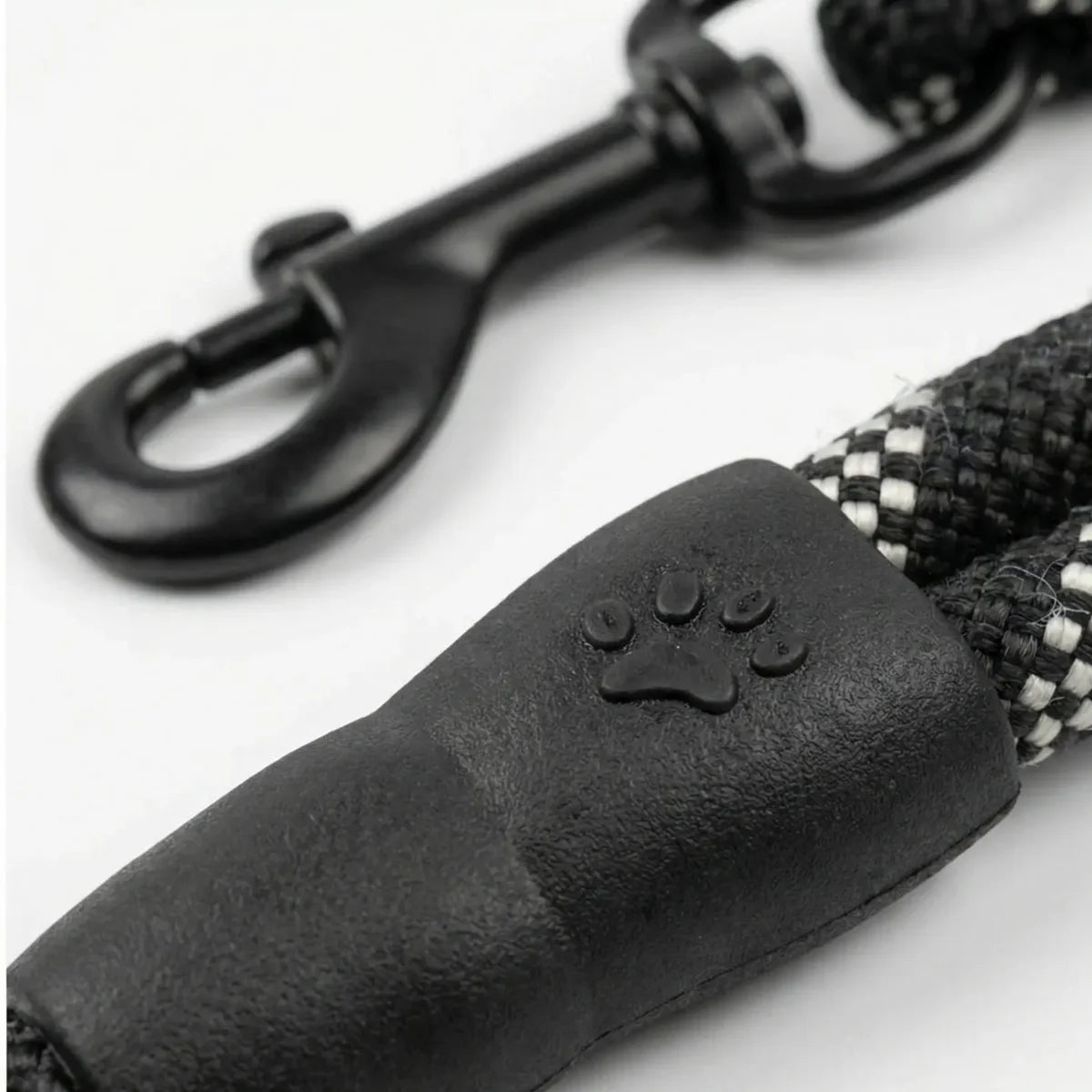 Heavy-duty metal hook on a black reflective dog leash for secure collar attachment.