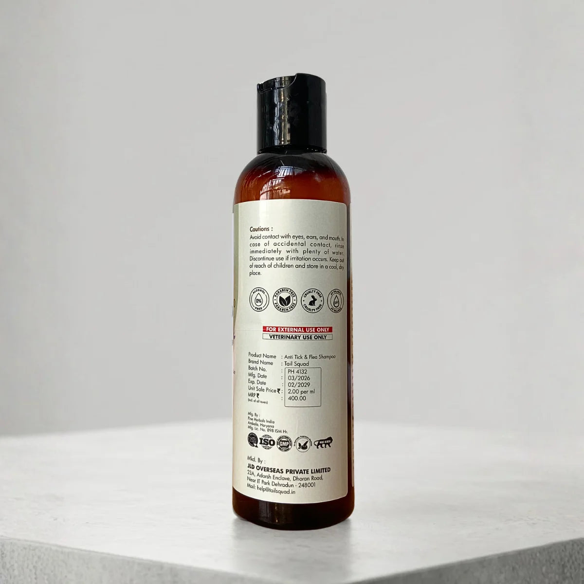 Back label of anti tick and flea dog shampoo showing cautions and usage instructions.