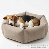 Dog sleeping inside Tail Squad Bolster Dog Beds front view cozy washable pet bed with soft comfort cushioning for dogs